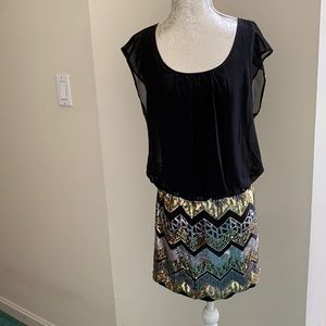 Stylish chevron pattern sequin bottom mini party dress.